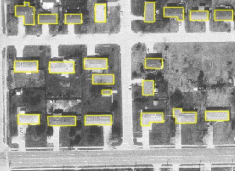 Here, buildings have been digitized (traced) on top of an aerial photo